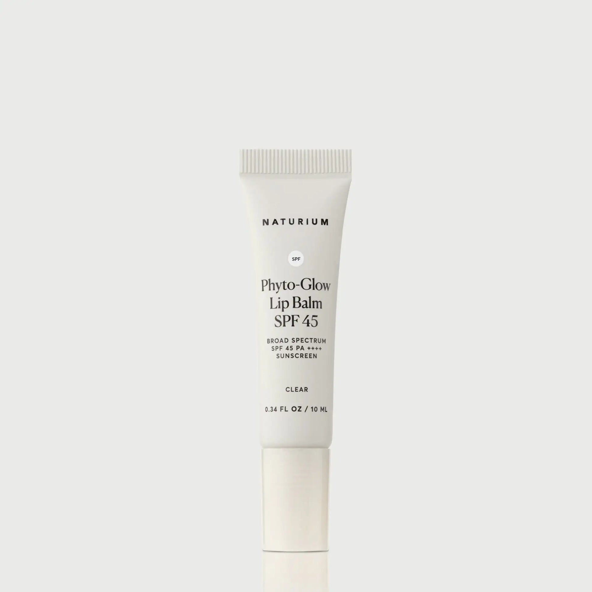 phyto-glow-lip-balm-spf-45-clear-e8 NATR-10124_PhytoGlow_SPF_Clear_primary_capon_front_bonebkgd_1.webp