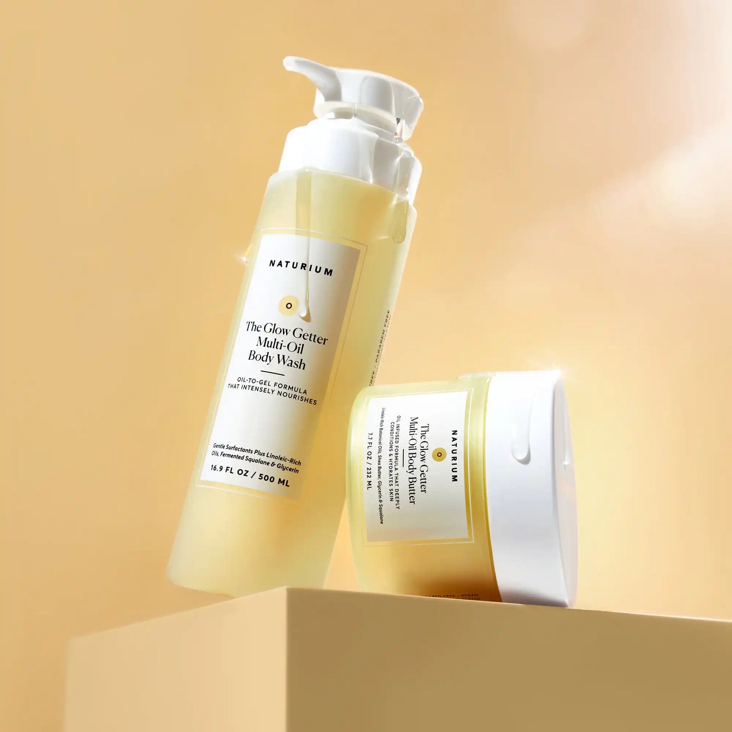 the-glow-all-out-body-bundle-a1 gg-bodybutter_1464-crop_revcolor_FL.webp